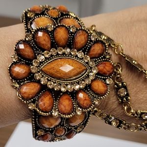 Amber and gold colored stoned hand bracelet